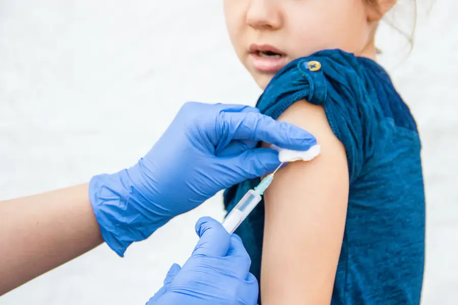 Woman having an injection in a pharmacy