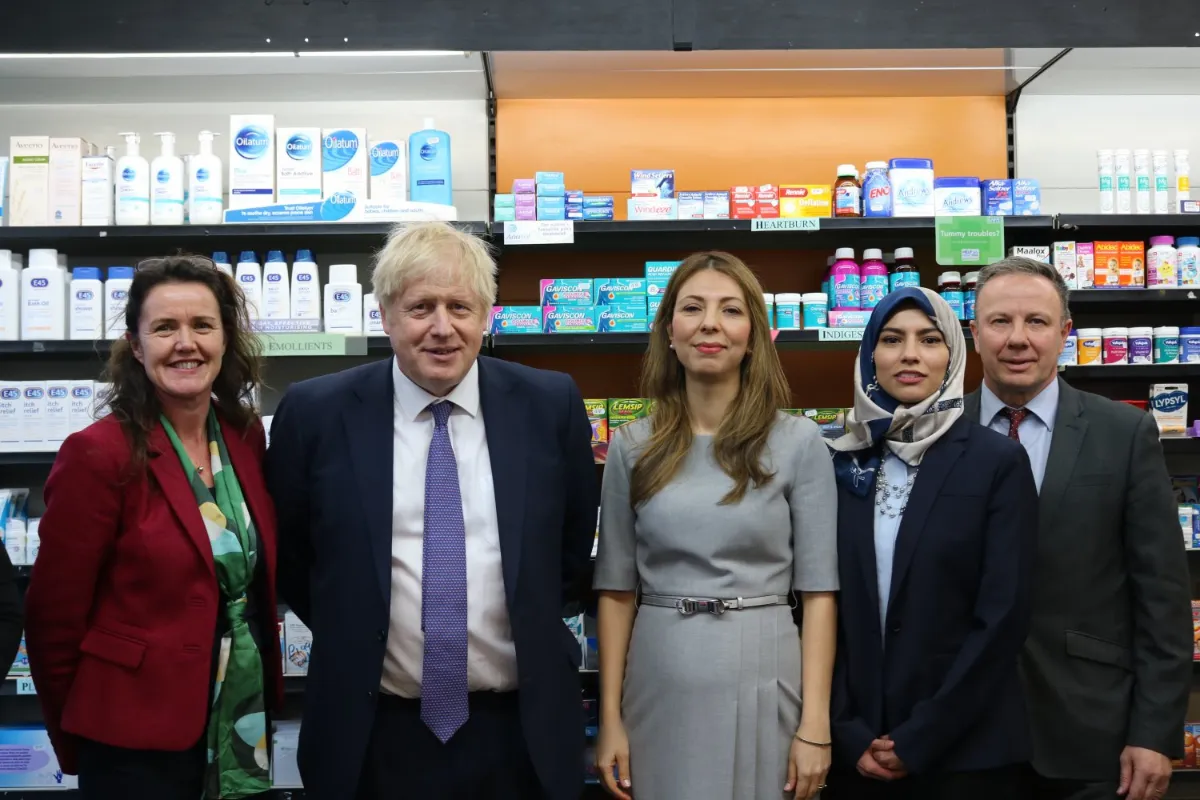 Leyla Hannbeck with Boris Johnson in a pharmacy