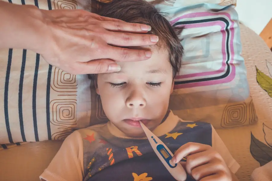 Child in bed with a temperature