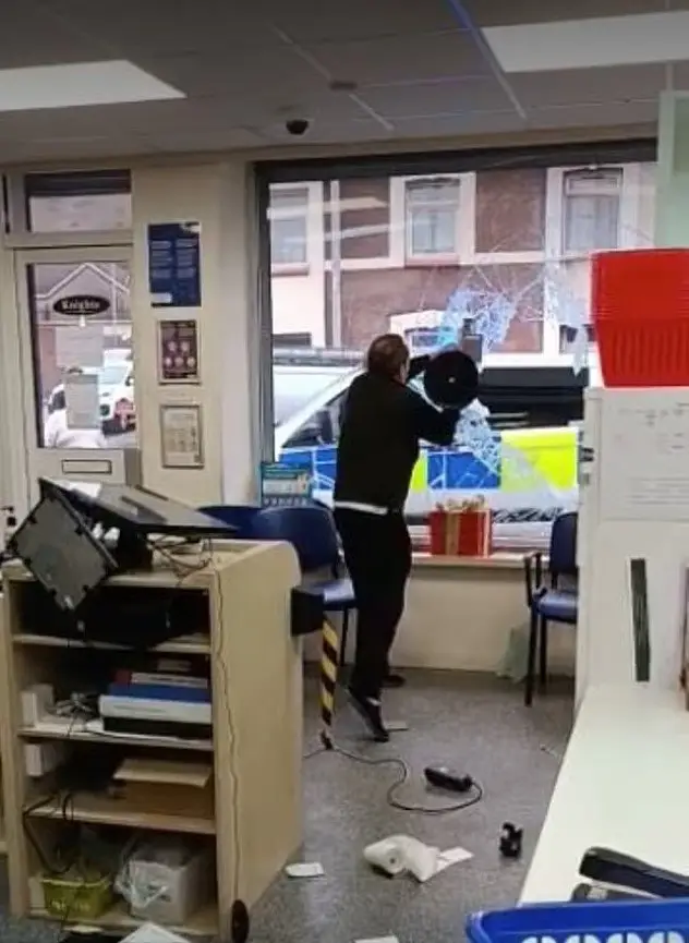 Male in an act of vandalism in a pharmacy